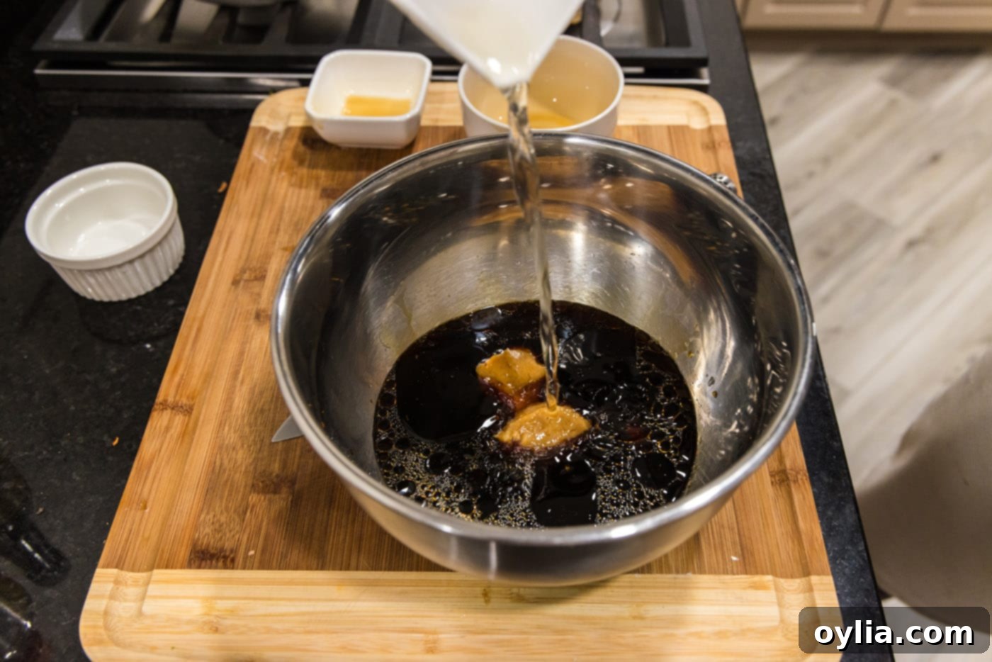 Pouring marinade ingredients into a bowl