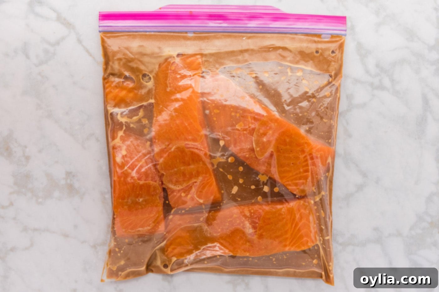 Miso salmon marinating in a gallon zipper bag in the fridge