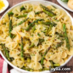 Close up photo of a bowl of Asparagus Pasta, showing the rich sauce and fresh ingredients.