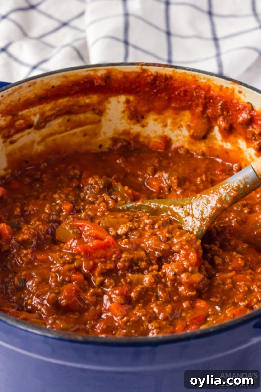 pot of bolognese sauce simmering on the stove