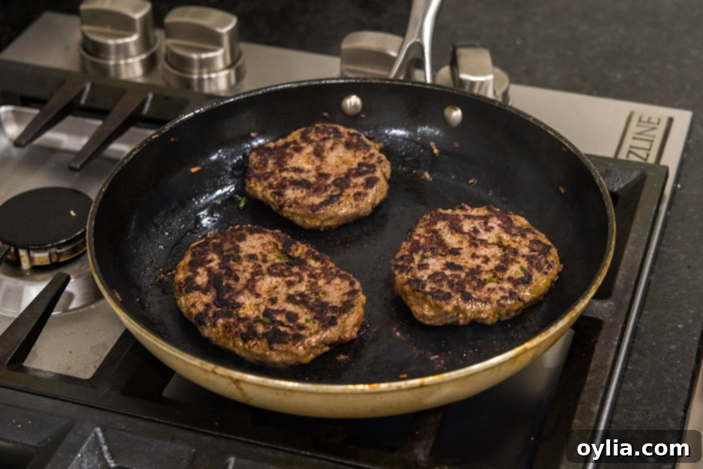 cooked buffalo burgers in a skillet