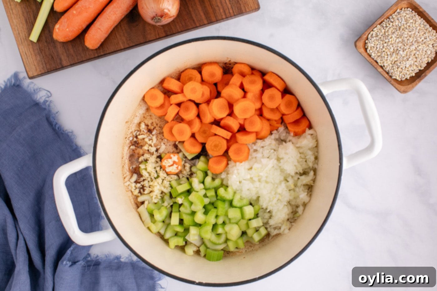 carrots, onion, celery, and garlic added to soup pot
