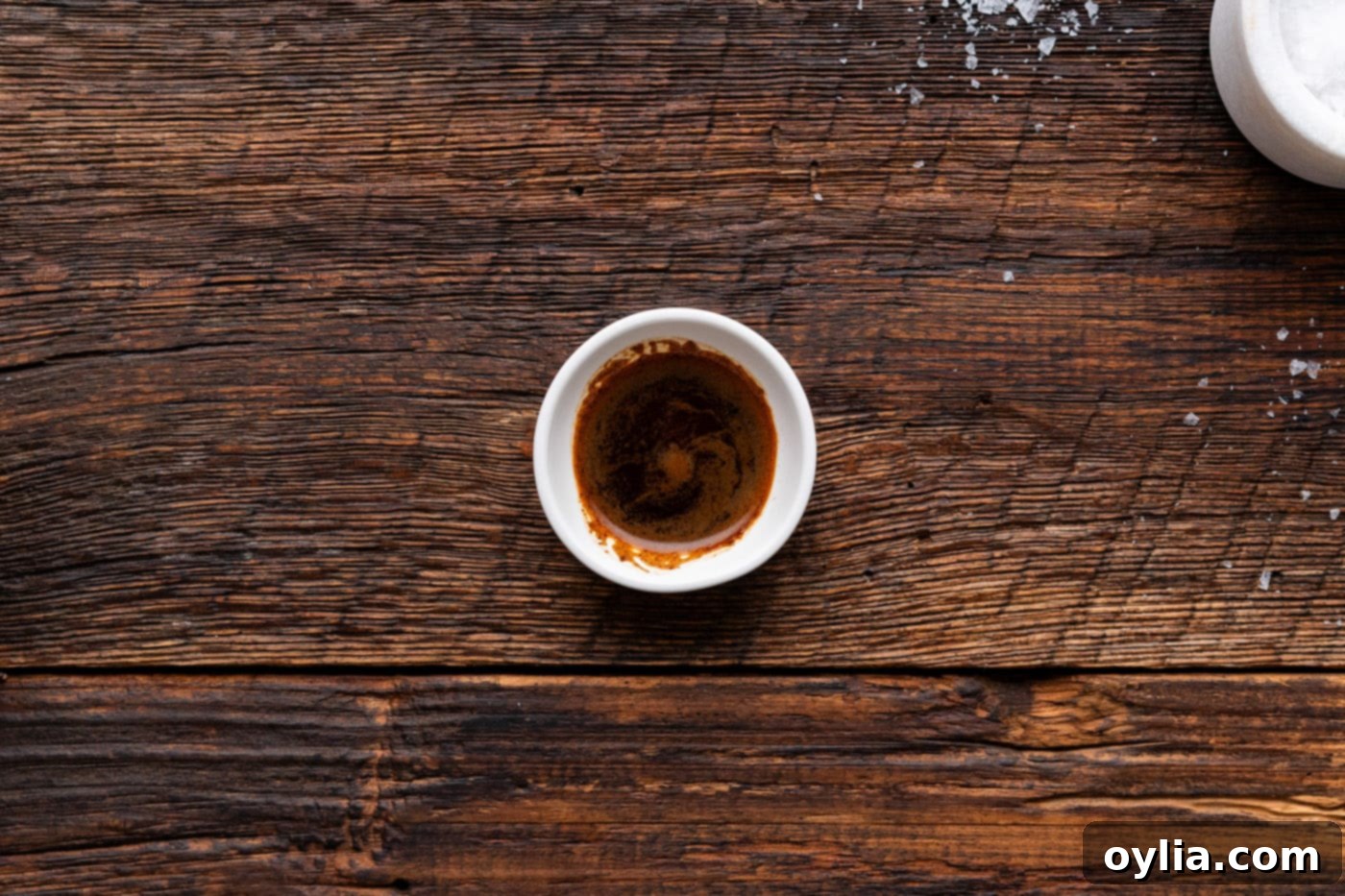 instant espresso powder mixed with water in a small bowl