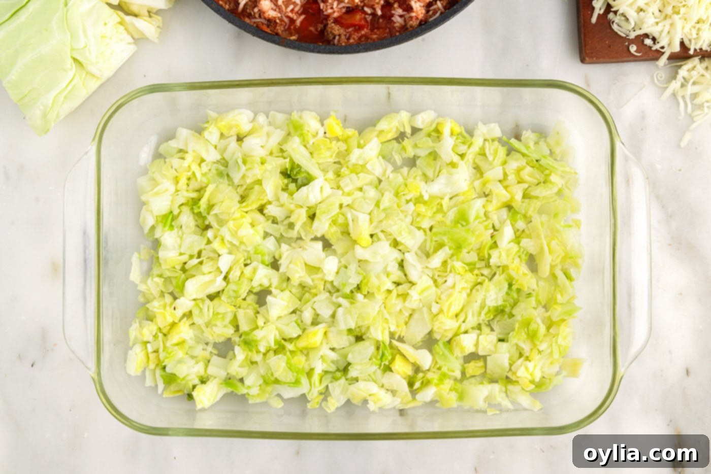 chopped cabbage on bottom of a baking dish
