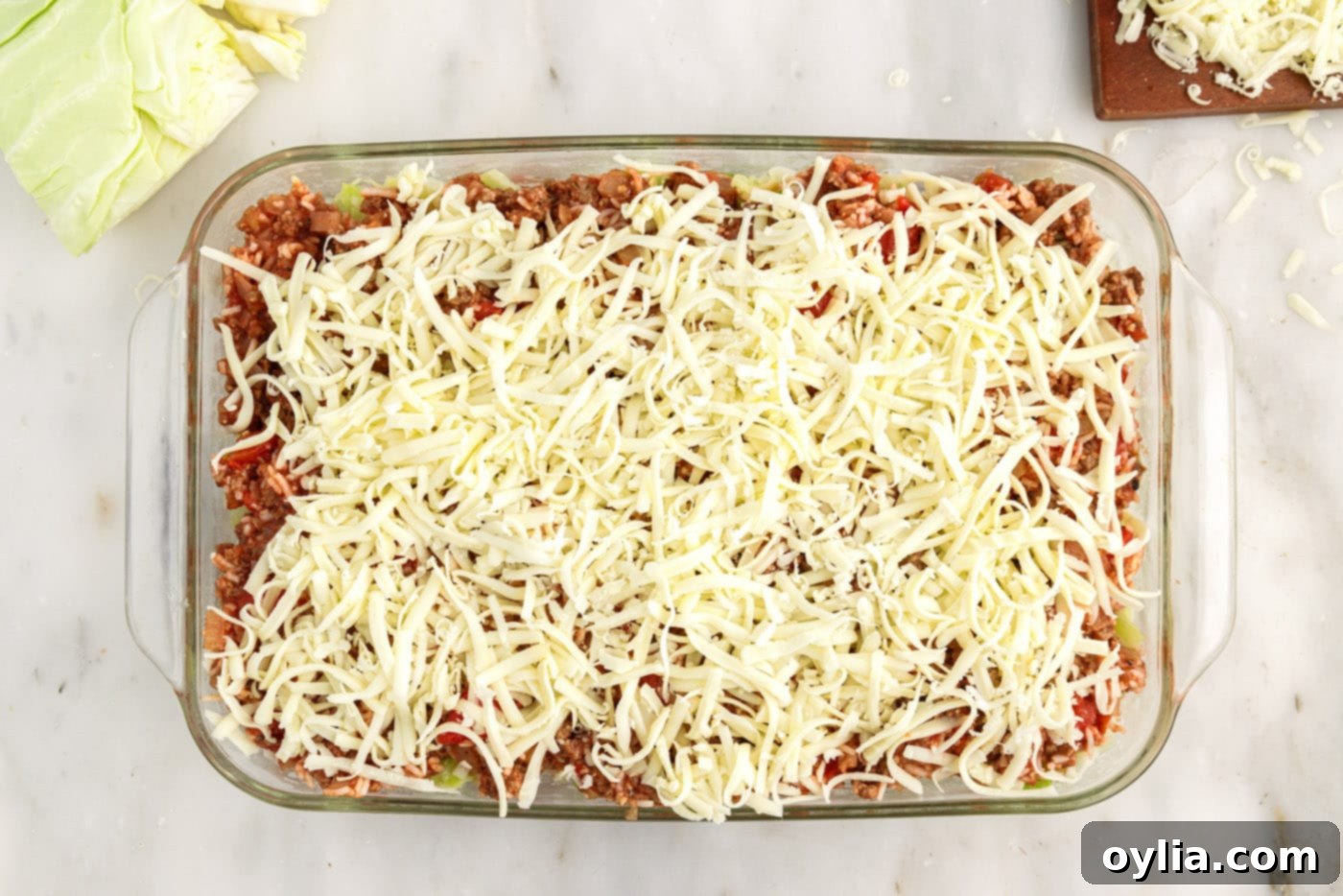 shredded cheese on top of cabbage roll casserole