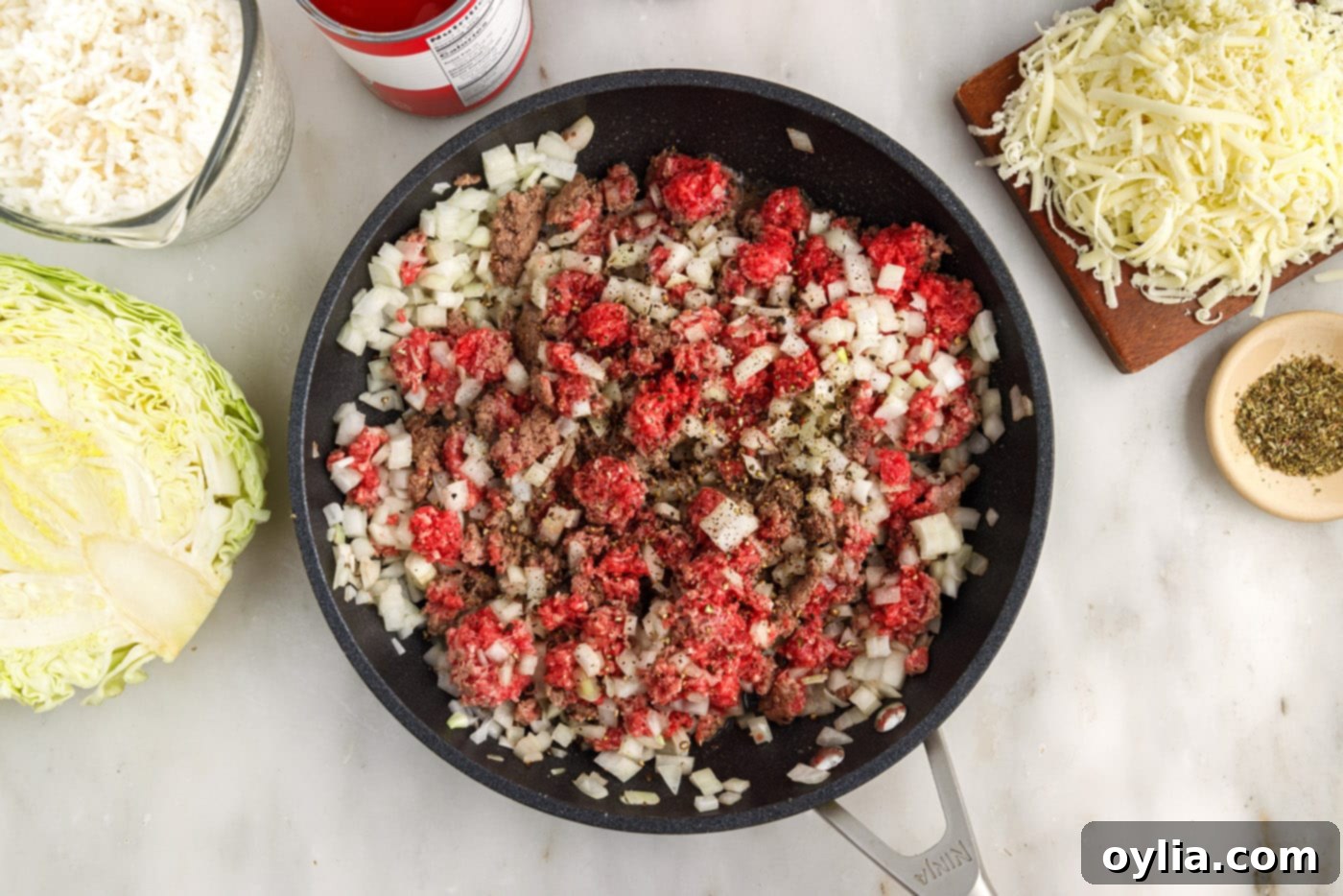 ground beef and onion in skillet
