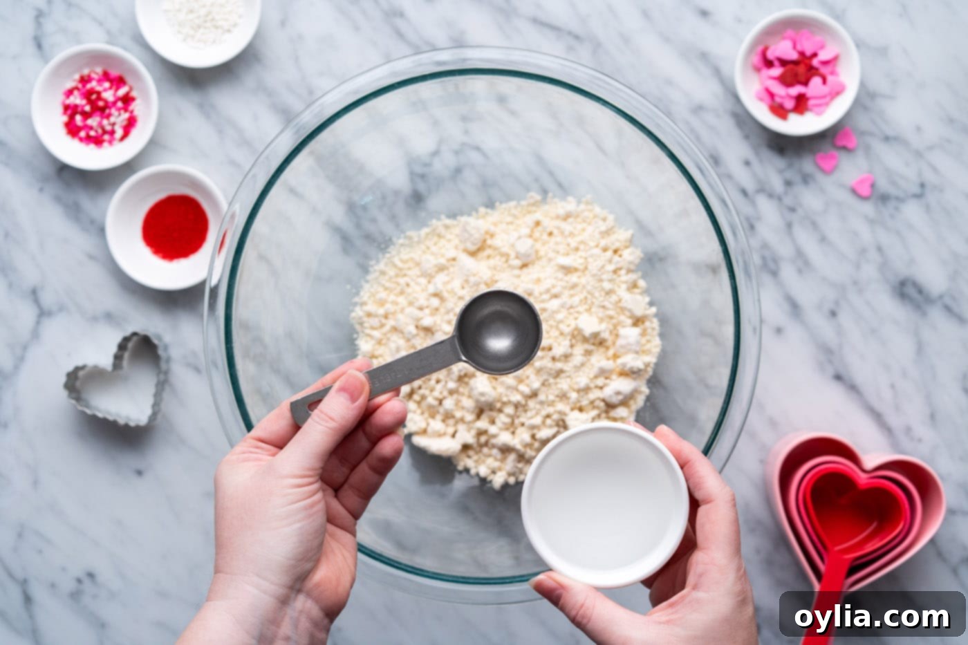 adding water to jiffy pie mix in bowl
