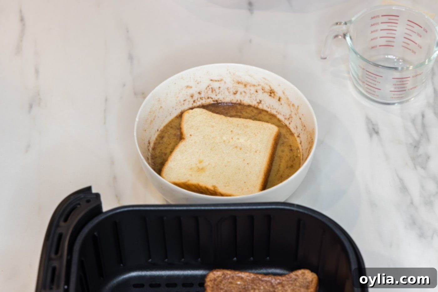 dipping bread into egg mixture