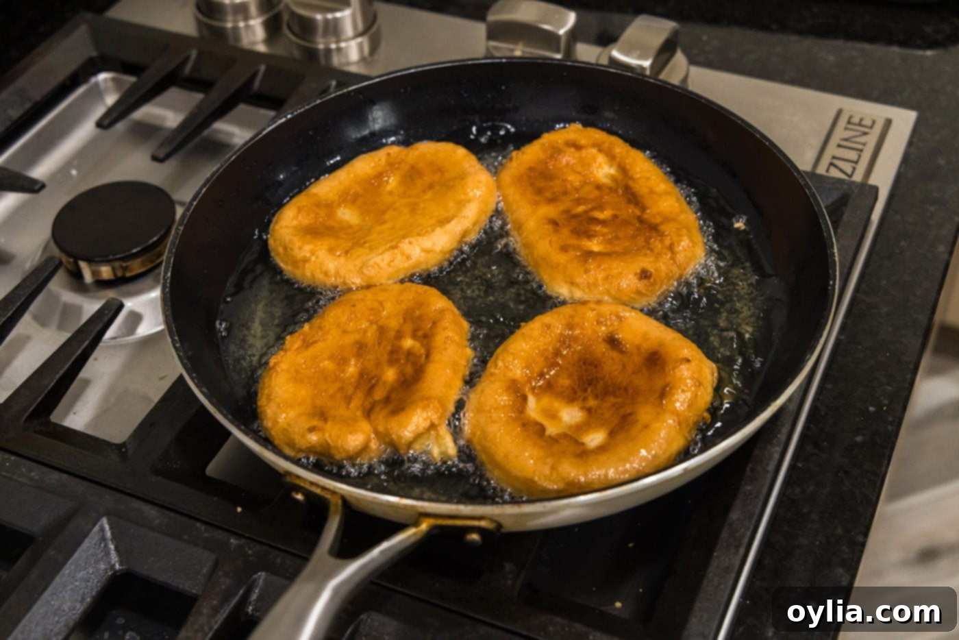 pan fried Korean fish cake in oil, showing one side browned