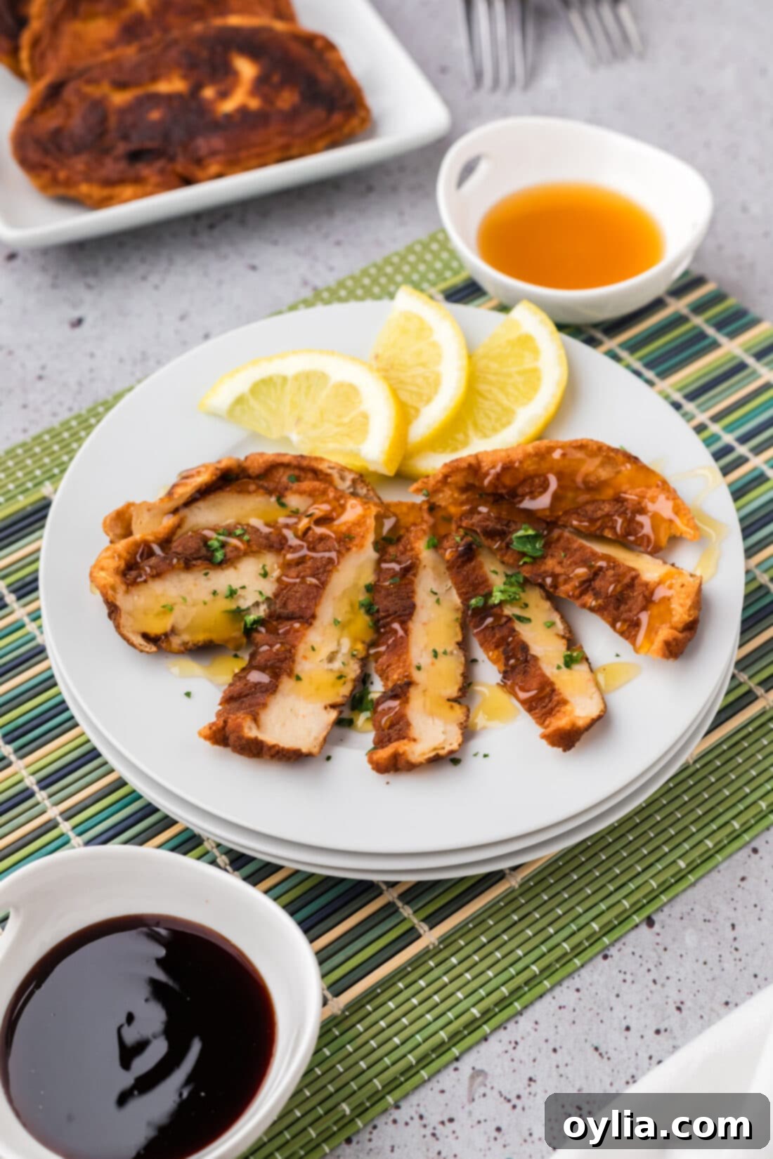 Sliced Korean Fish Cake on a plate with lemon slices, ready to serve