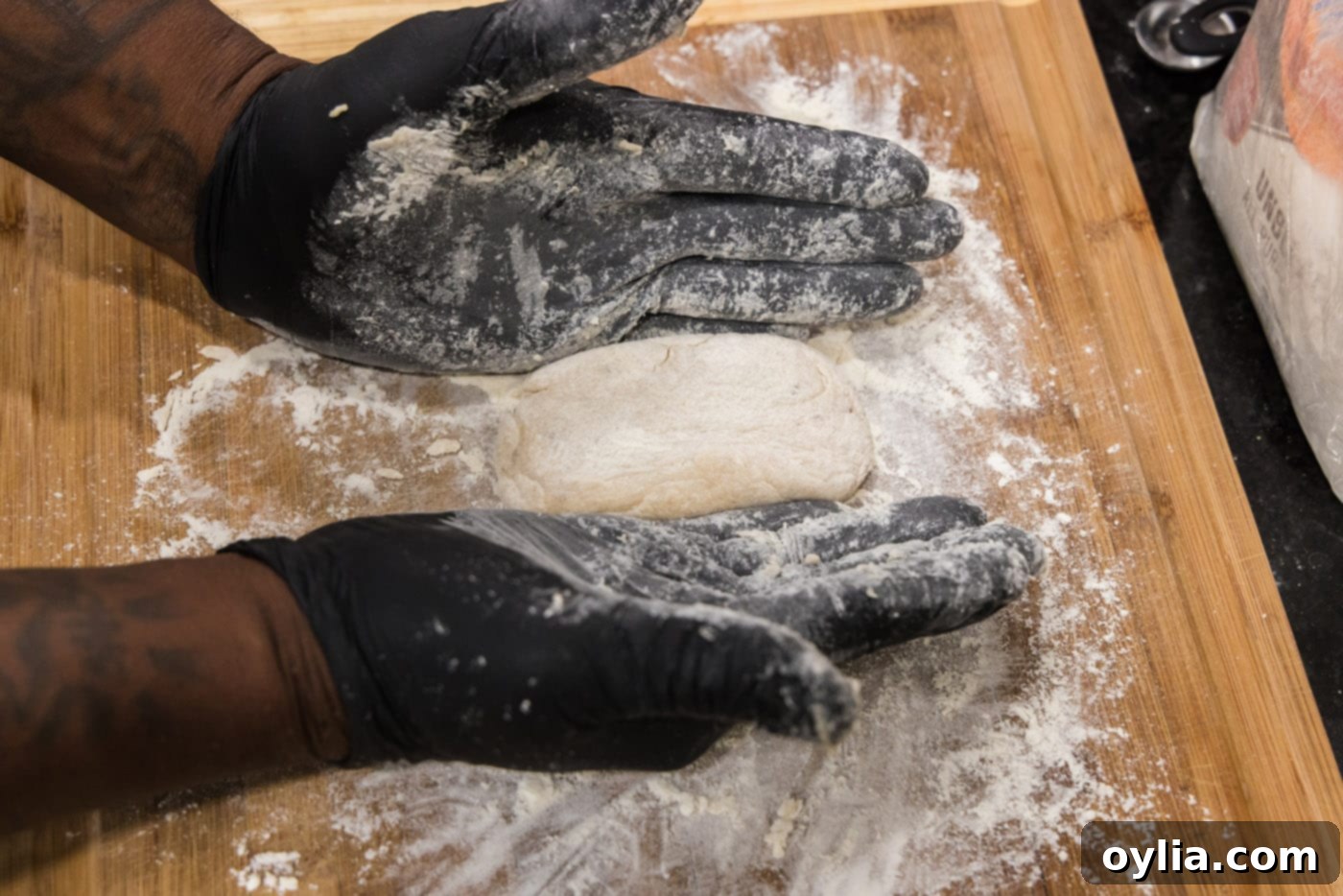 shaping fish cake dough with gloved hands