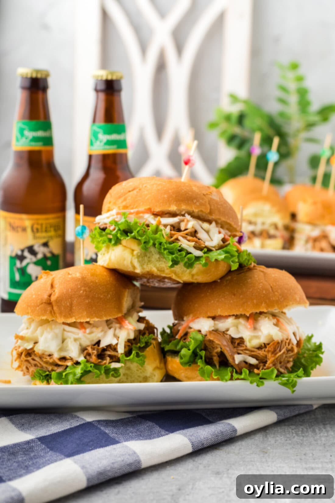 A stack of beautifully assembled BBQ Chicken Sandwiches.