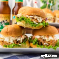 Close up photo of a stack of BBQ Chicken Sandwiches ready to serve.