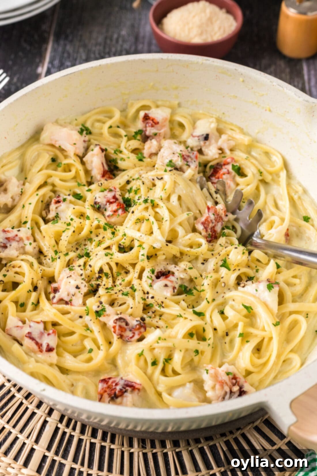Decadent Lobster Pasta 3 Lobster Pasta in a skillet with a spoon