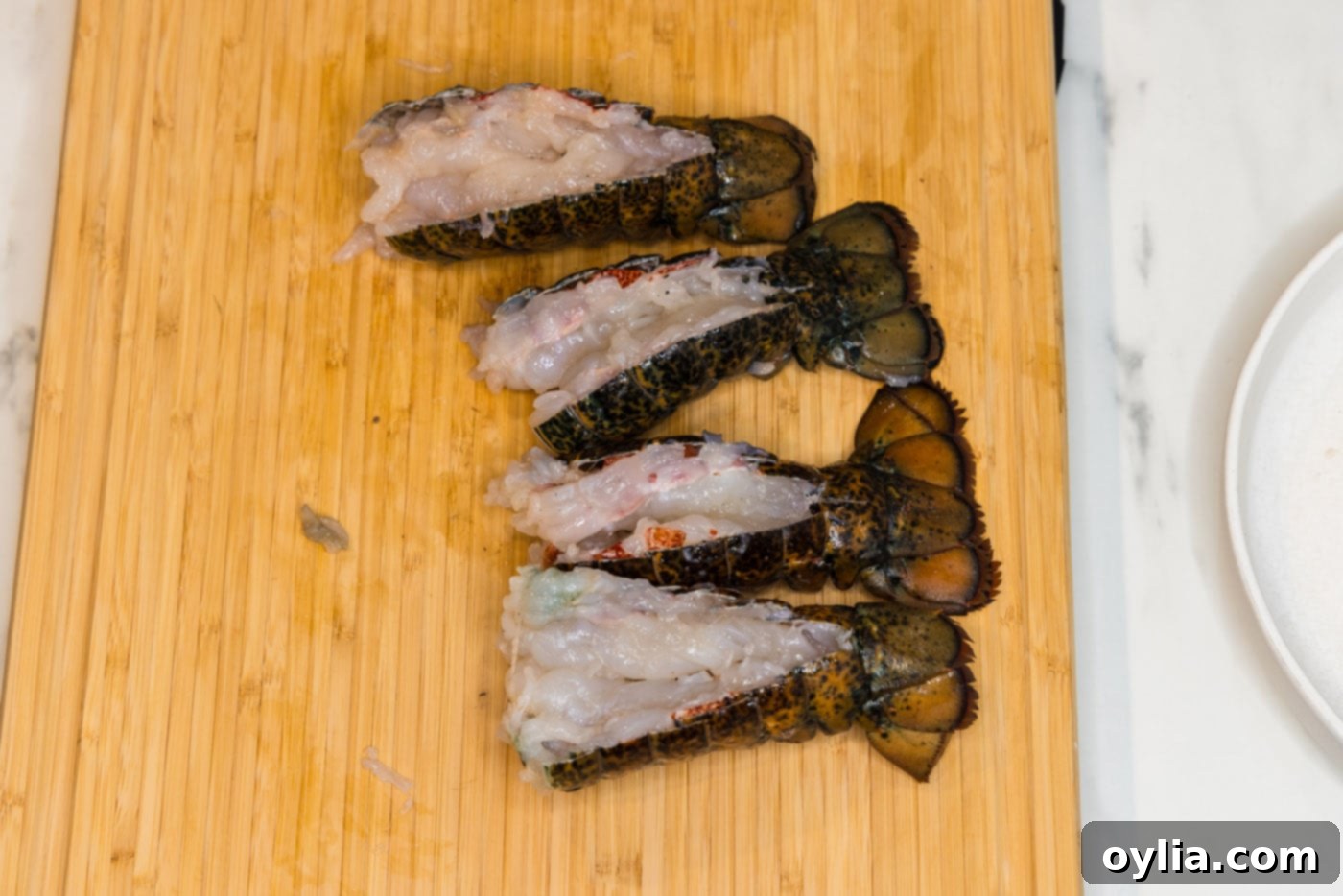 lobster meat poking out of opened shells