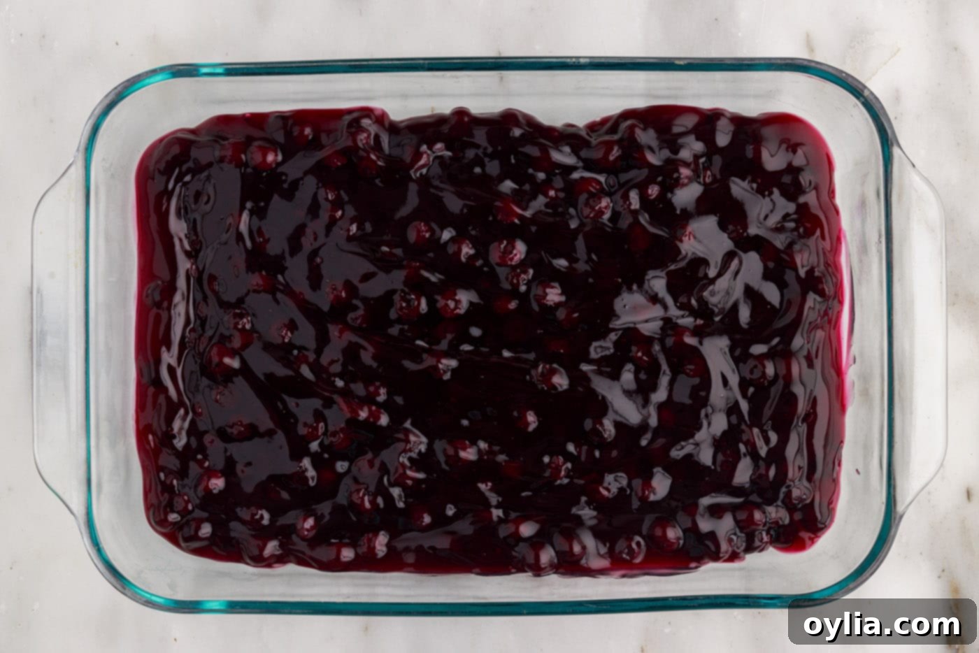 blueberry pie filling on bottom of baking dish