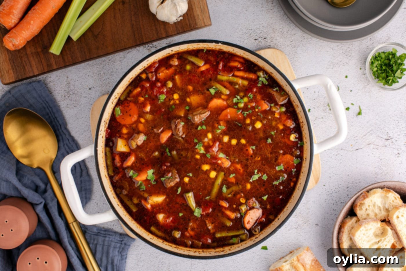 overhead of finished beef vegetable soup in a dutch oven