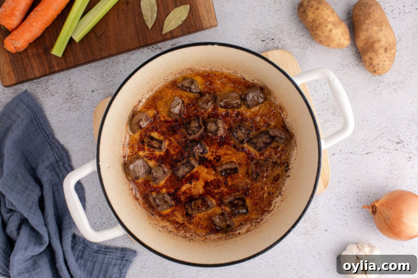 beef stewing meat browned in a dutch oven