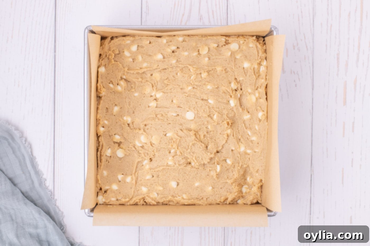browned butter blondie batter in a baking pan