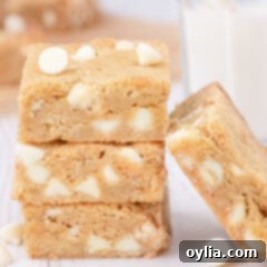 Chewy Golden Blondies 14 Three Blondies stacked with one resting on the side