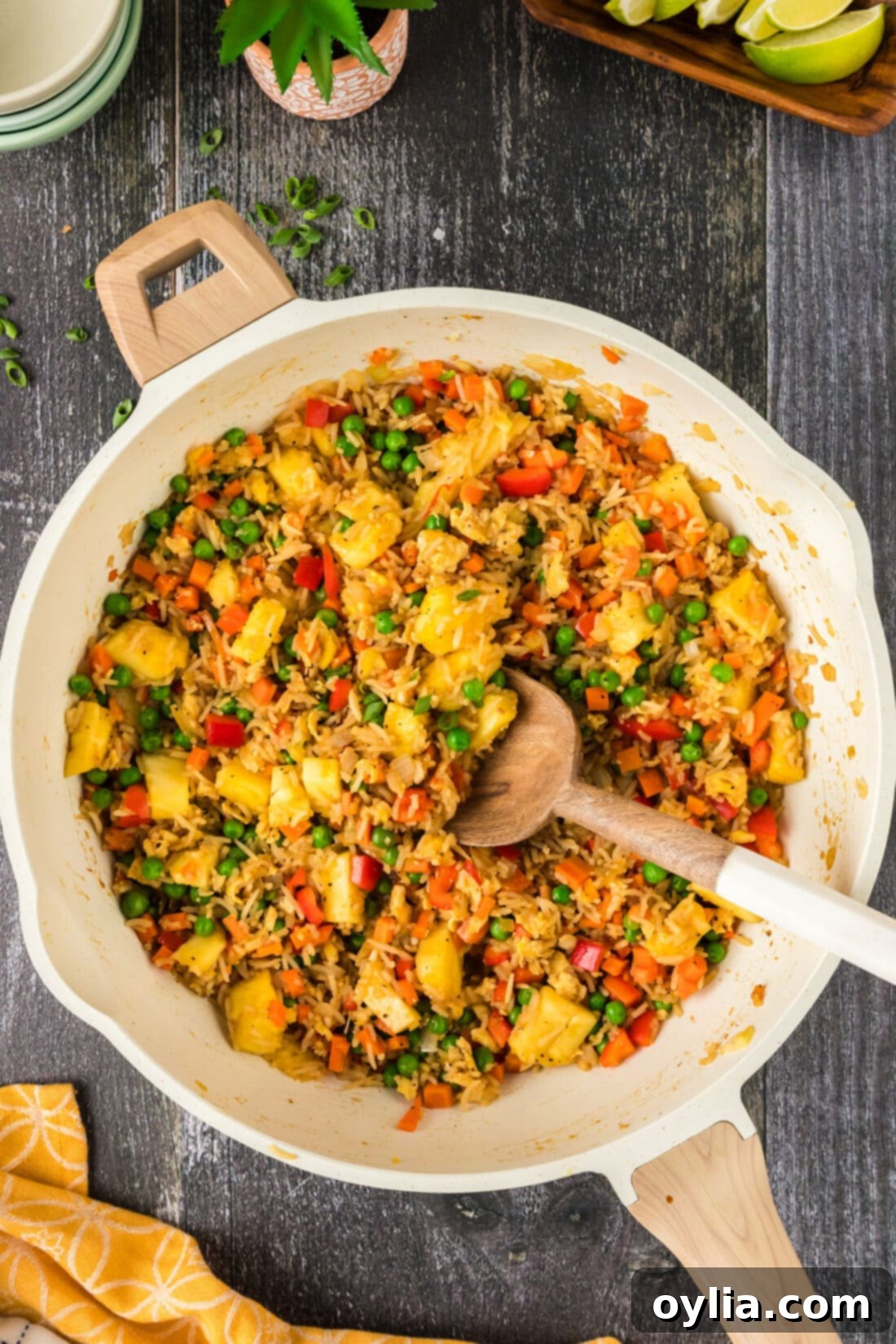 Pineapple Fried Rice in a skillet with a spoon