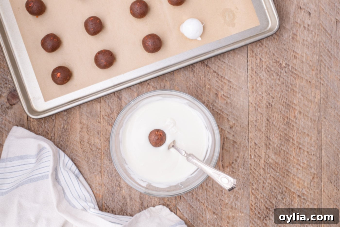 dipping carrot cake balls in white chocolate