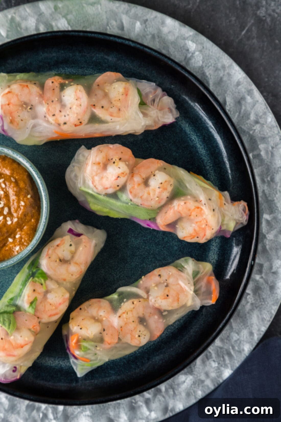 Close up overhead photo of Shrimp Spring Rolls on a plate, showcasing their vibrant filling