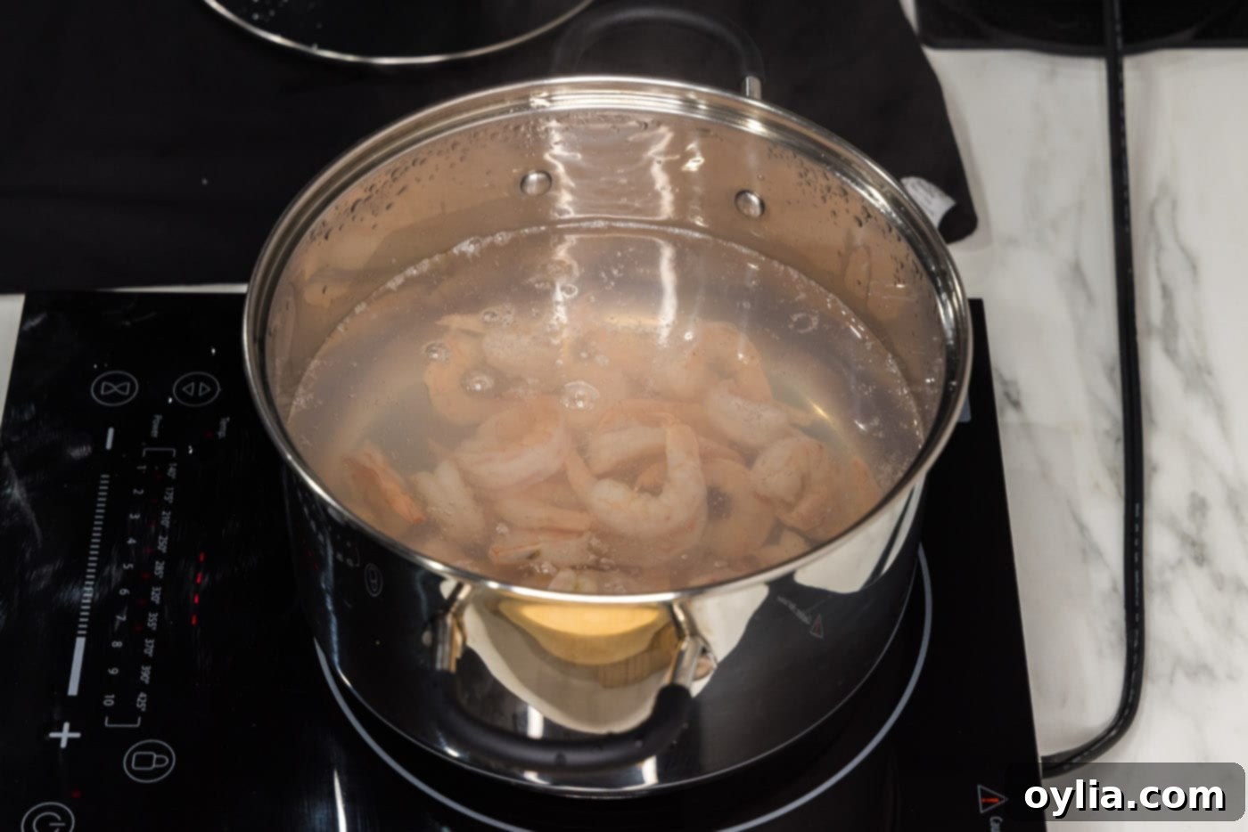 boiling shrimp in a stock pot until perfectly pink and tender