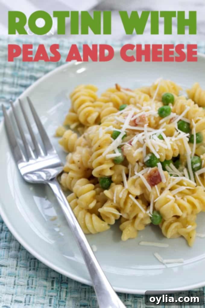 rotini peas and cheese with a fork, ready to eat, for Pinterest