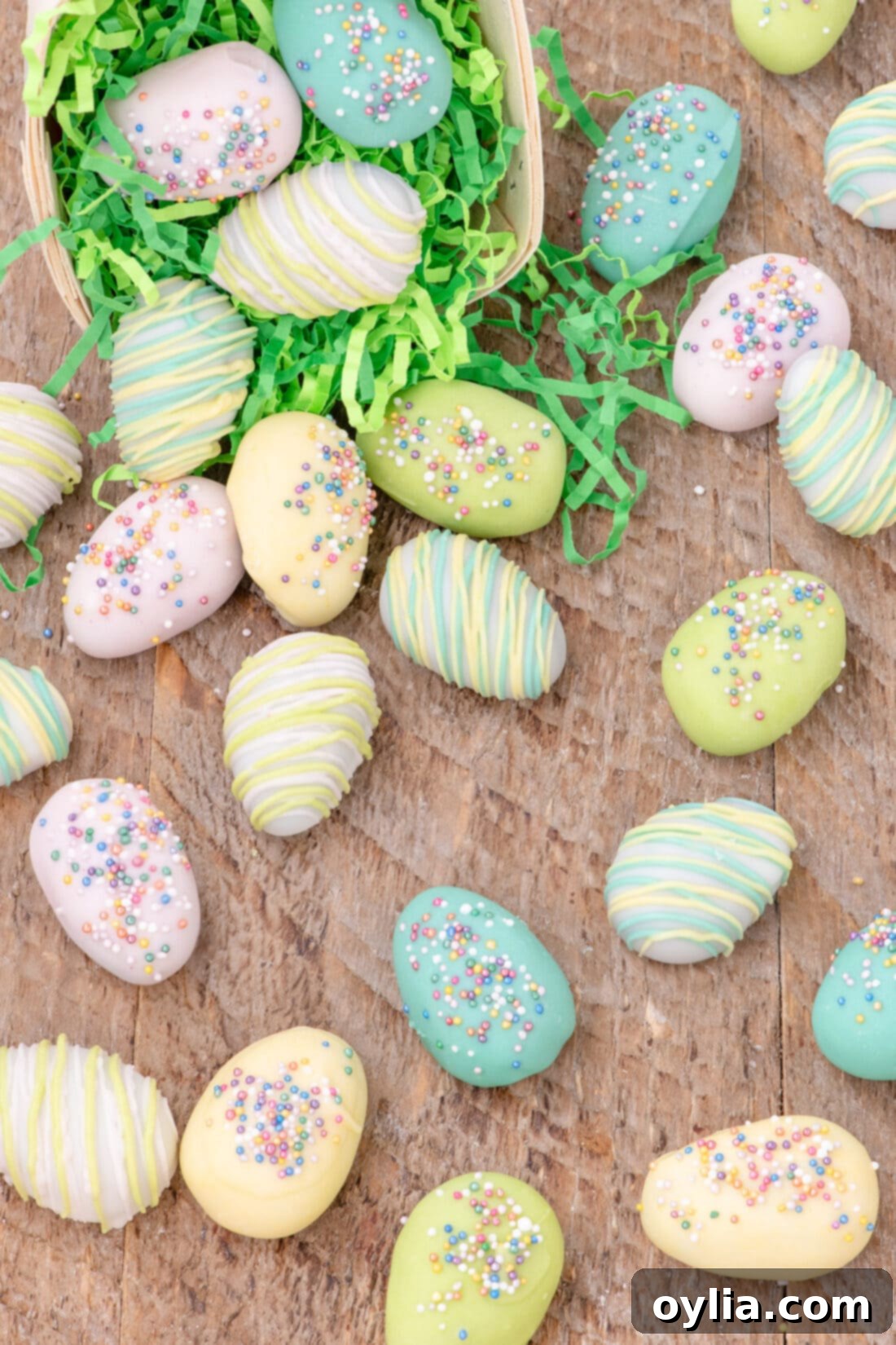 Easter Egg Oreo Truffles sprinkled out of an Easter basket, showcasing pastel colors