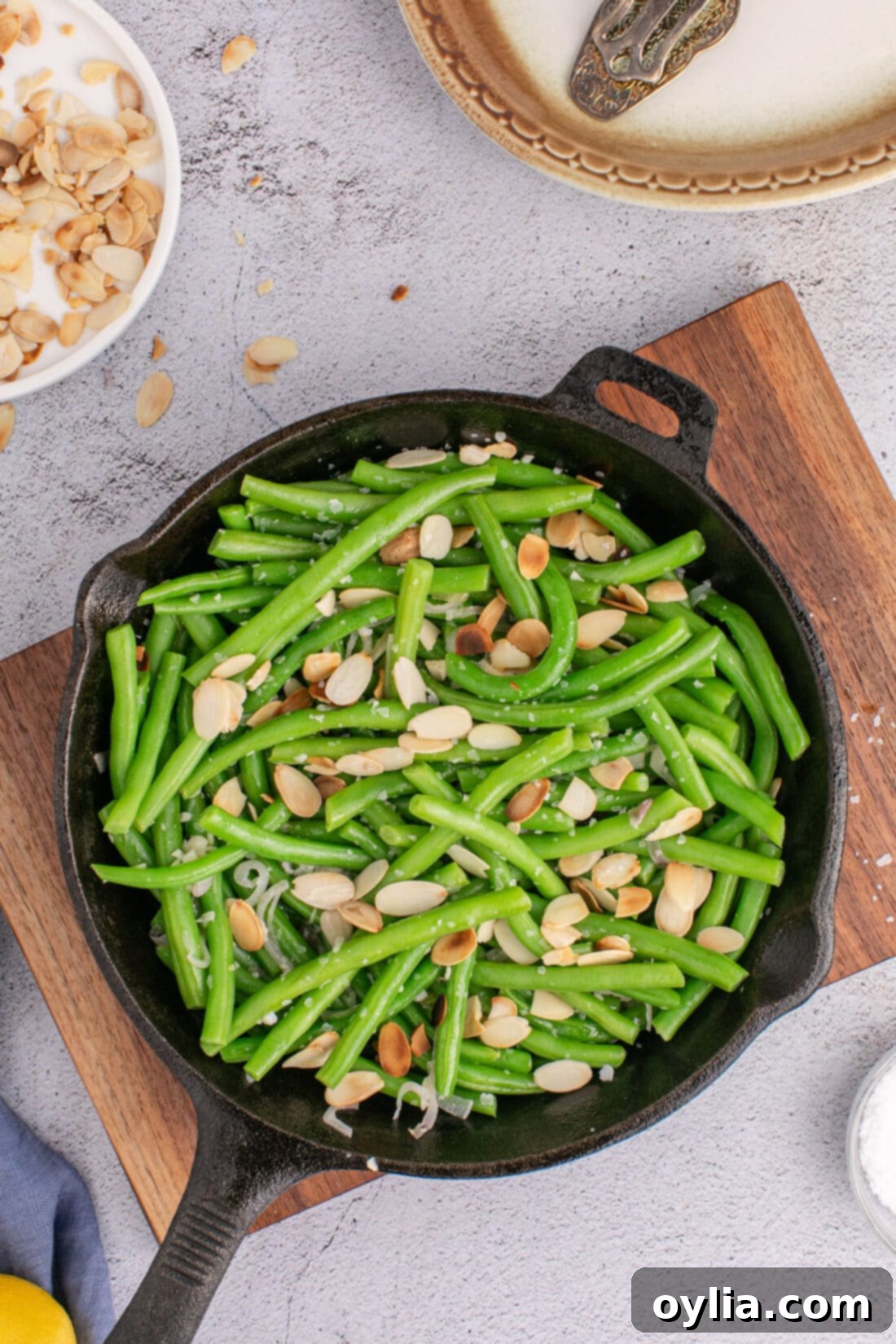 Almond-Kissed Green Beans 2 Green Beans Almondine in a skillet