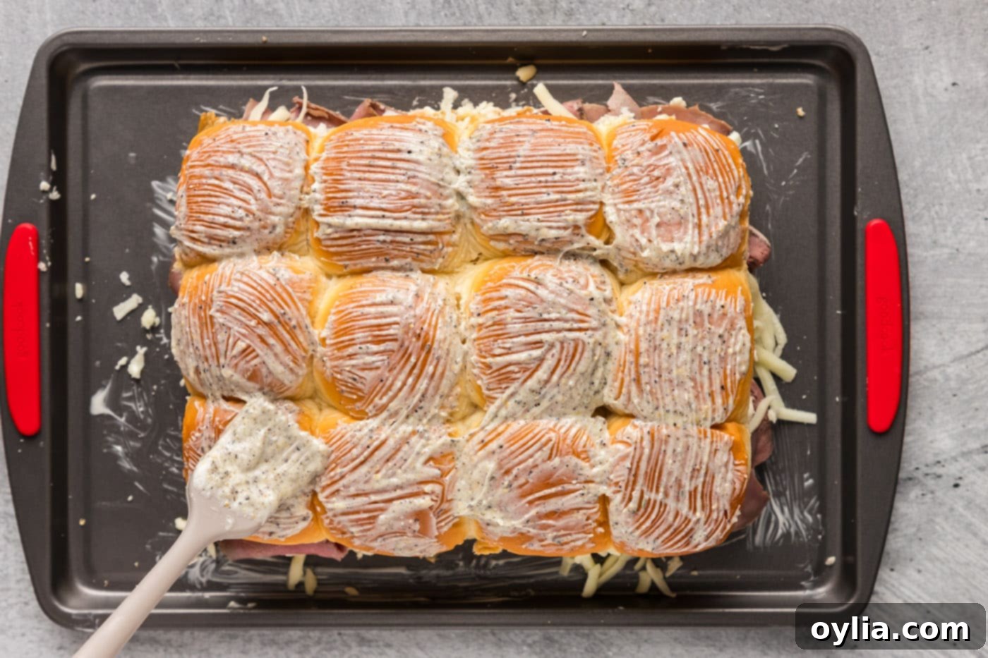 basting slider buns with garlic butter
