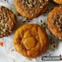 A close up overhead photo of pumpkin mini cakes with cinnamon streusel topping.