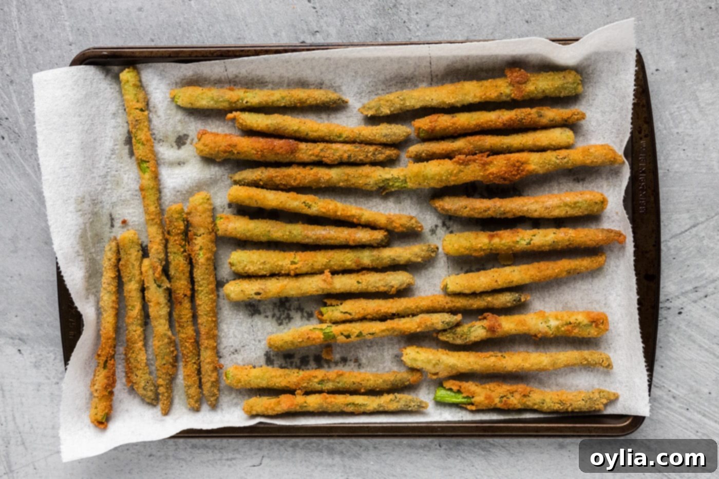 fried asparagus draining on paper towels