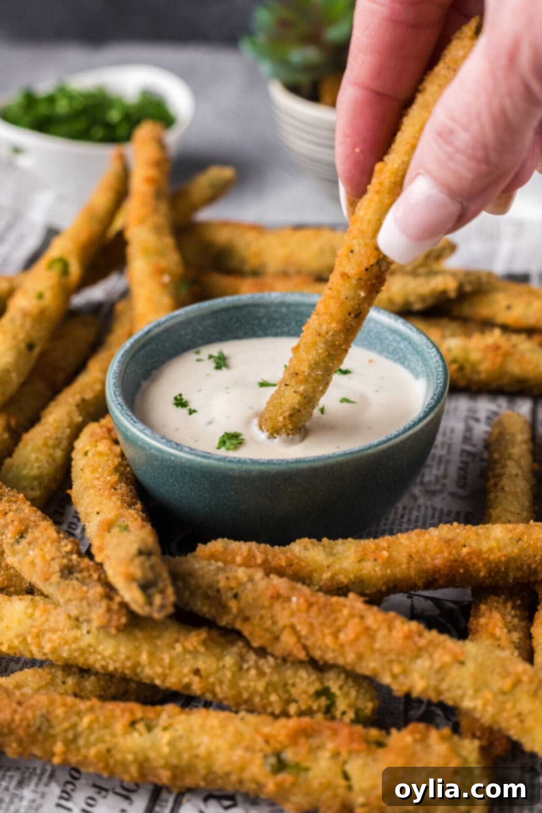 Pan-Seared Asparagus Spears 13 Fried Asparagus being dipped into ranch