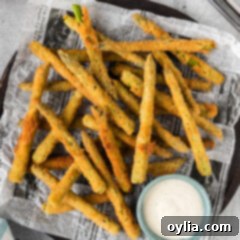 Pan-Seared Asparagus Spears 14 Fried Asparagus on a platter with a bowl of ranch