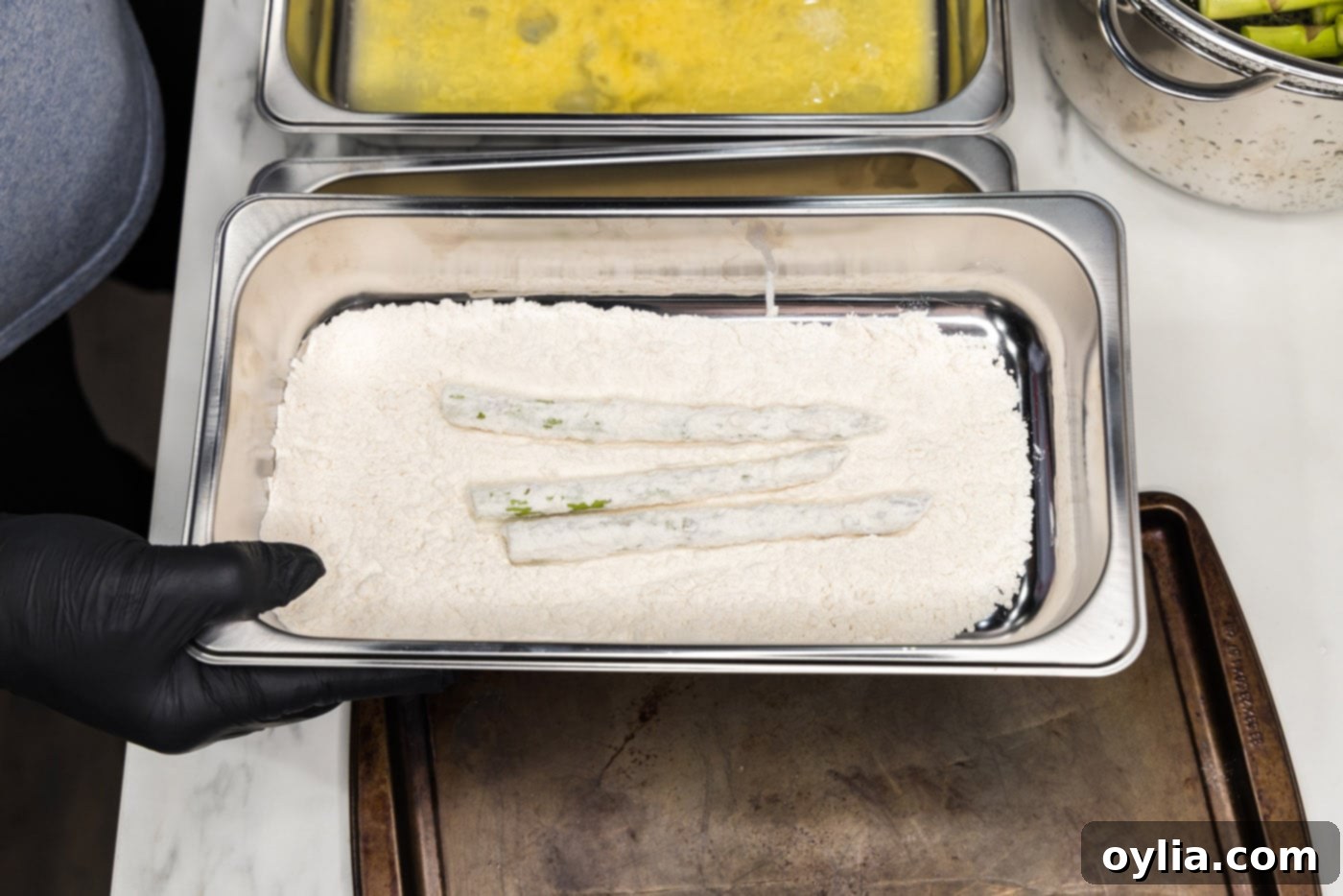 Pan-Seared Asparagus Spears 8 dipping asparagus spears into flour