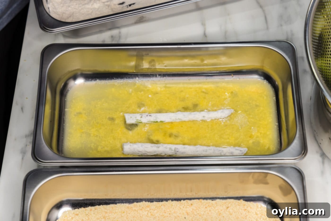 Pan-Seared Asparagus Spears 9 dipping asparagus spears into egg