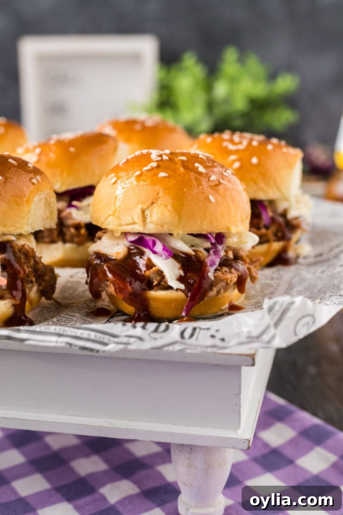 Close up photo of a Pulled Pork Slider on a serving platter, ready to be enjoyed
