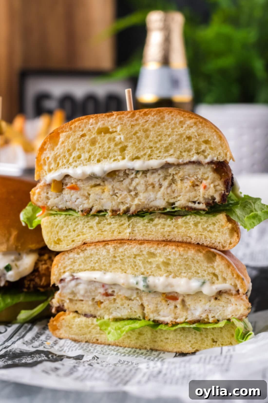 Two halves of a Fish Burger stacked on top of each other, revealing the textured fish patty.