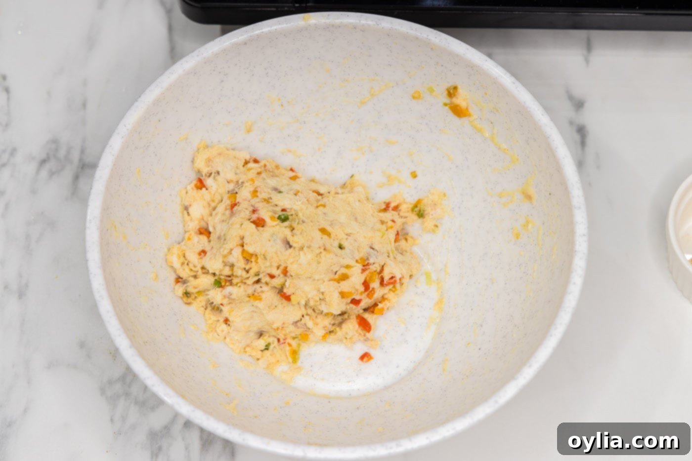 the fully mixed fish patty mixture in a bowl, ready to be formed