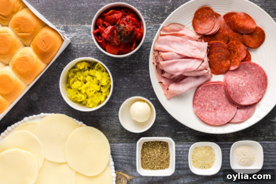 Ingredients for Italian Sliders laid out on a cutting board