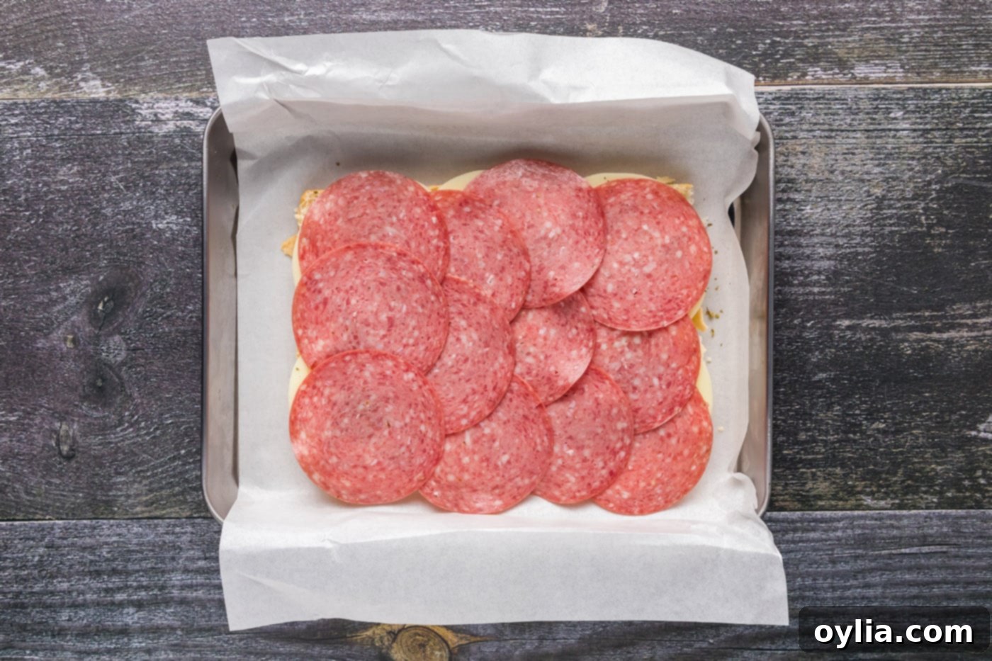 layer of salami over provolone sliders