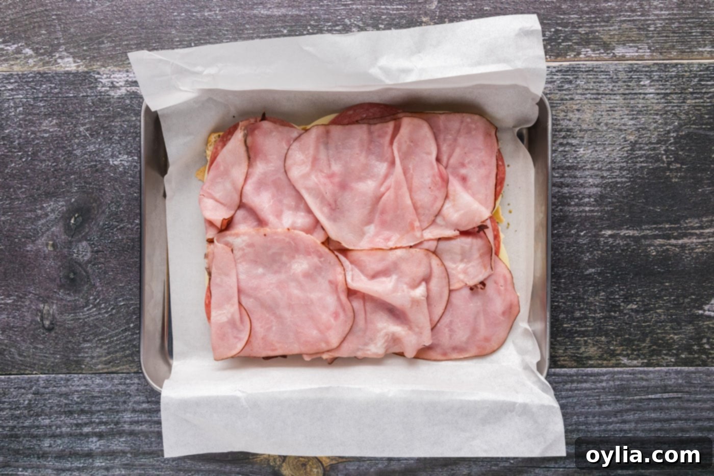 deli ham layered over salami and provolone cheese