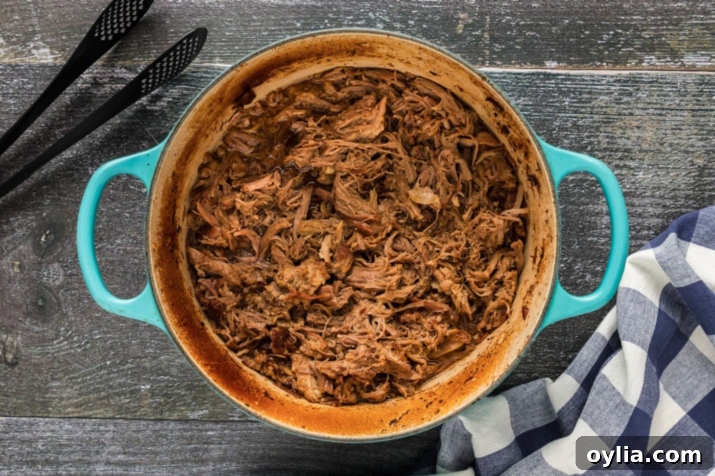 Ultimate Pulled Pork Tacos 5 Juicy, tender pulled pork slow cooking in a Dutch oven, ready for shredding.