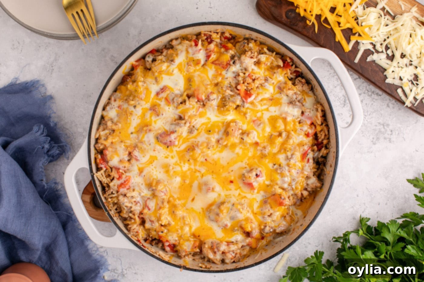 The finished easy stuffed pepper casserole, piping hot and ready to serve, presented beautifully in a deep skillet.