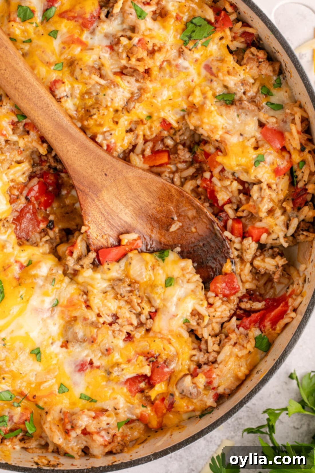Hearty Stuffed Pepper Bake 3 A rustic dutch oven filled with the rich and savory Stuffed Pepper Casserole, with a serving spoon resting inside, ready to be dished out.