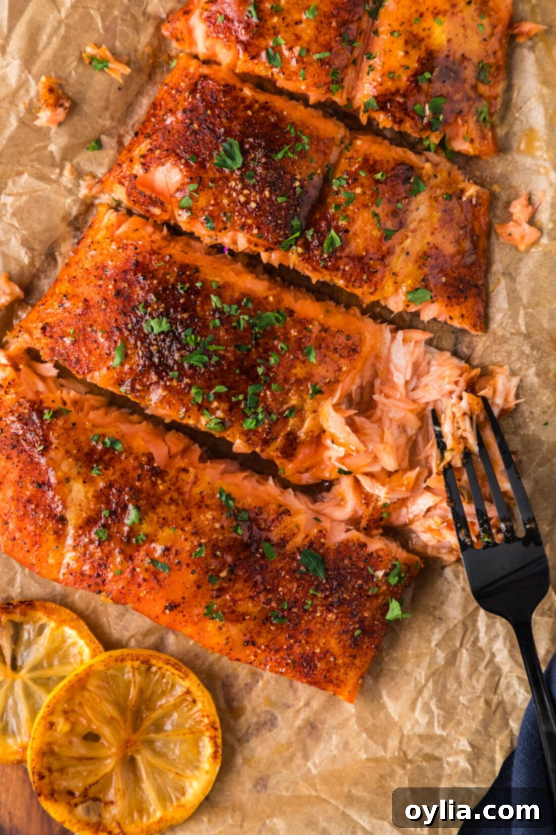 Gourmet Smoked Salmon 18 Fork pulling apart a filet of Smoked Salmon, showcasing its flaky texture