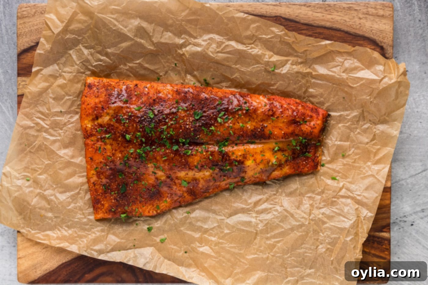 Easy smoked salmon recipe resting on parchment paper after cooking