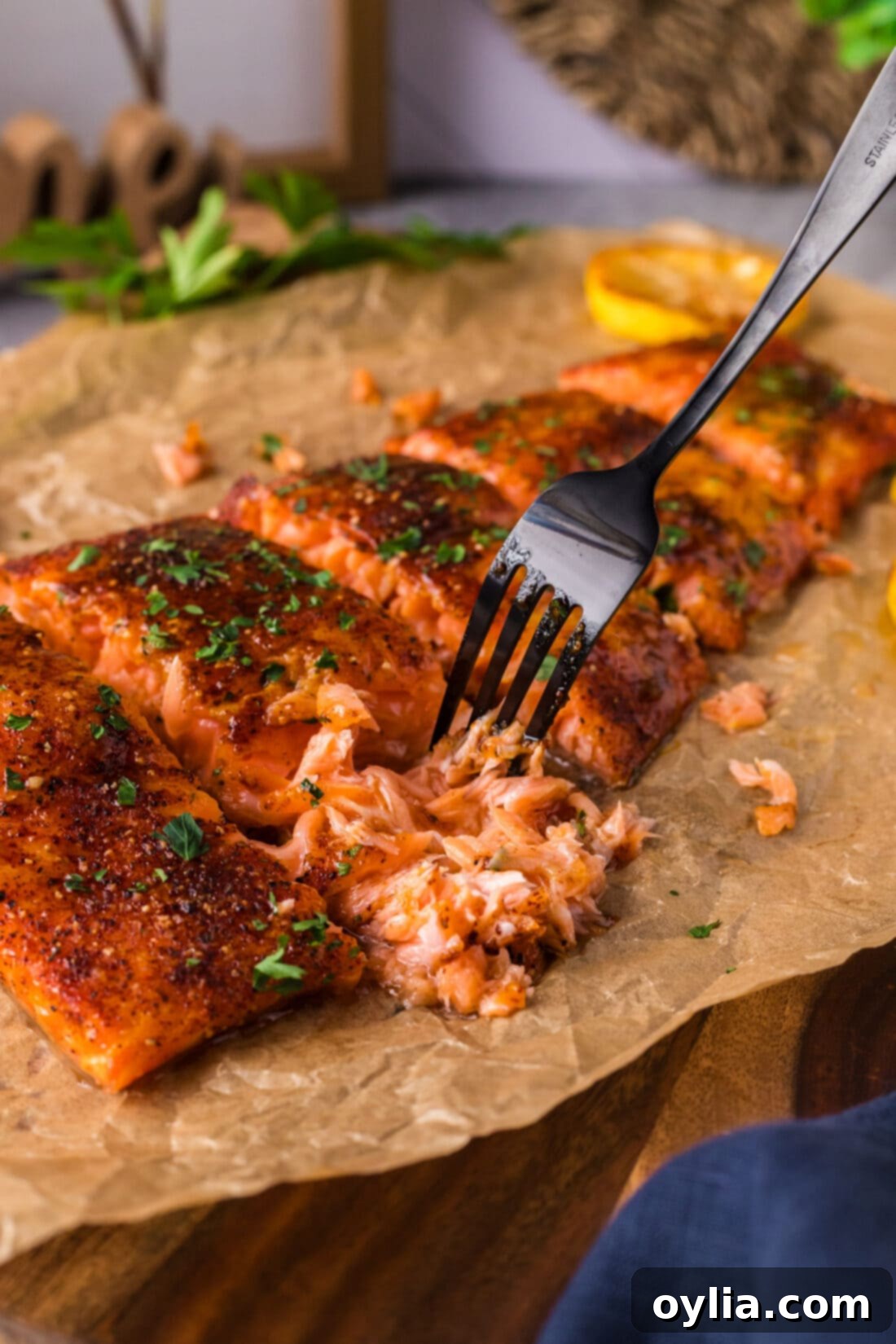 Close up of fork pulling apart smoked salmon, showing delicate flakes